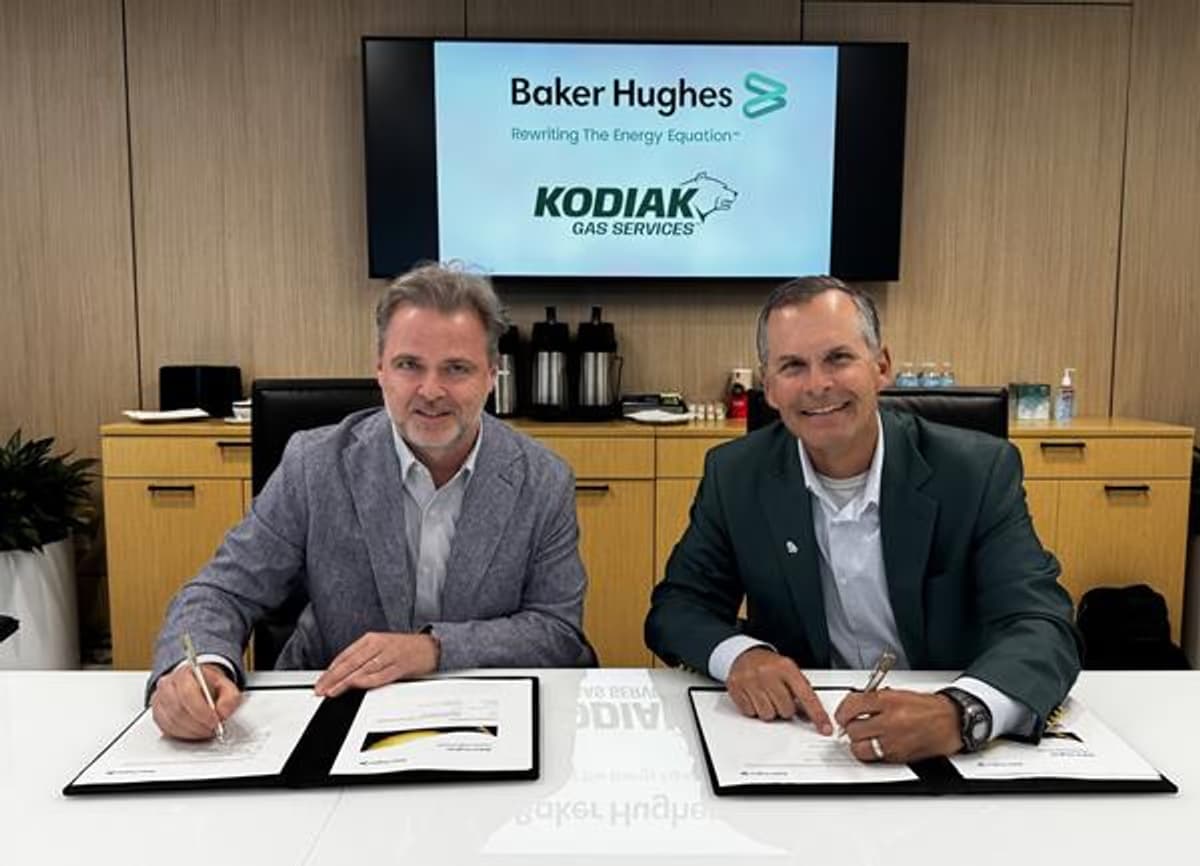 Baker Hughes and Kodiak Gas Services representatives at a contract signing ceremony for a multi-year gas turbine agreement