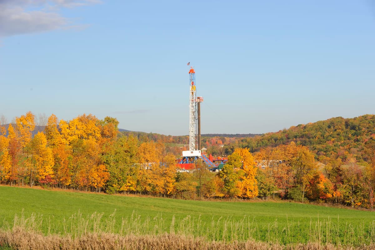 Horizontal rotary drilling rig operating at an oil and gas well site in daylight