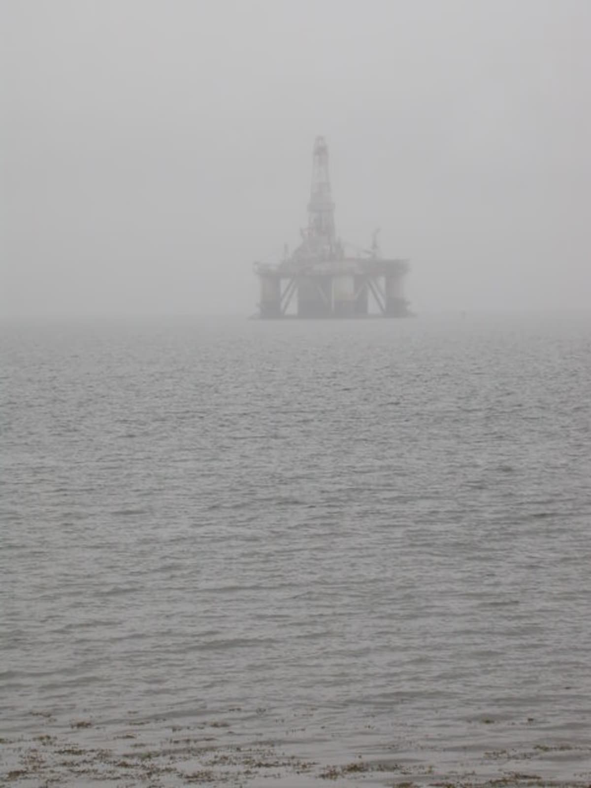 Semi-submersible oil drilling rig in mist on Cromarty Firth near Rosskeen Scotland