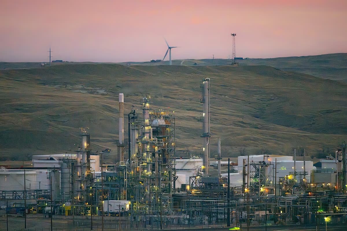 Sinclair refinery in Casper Wyoming at sunrise with distillation towers and processing units visible