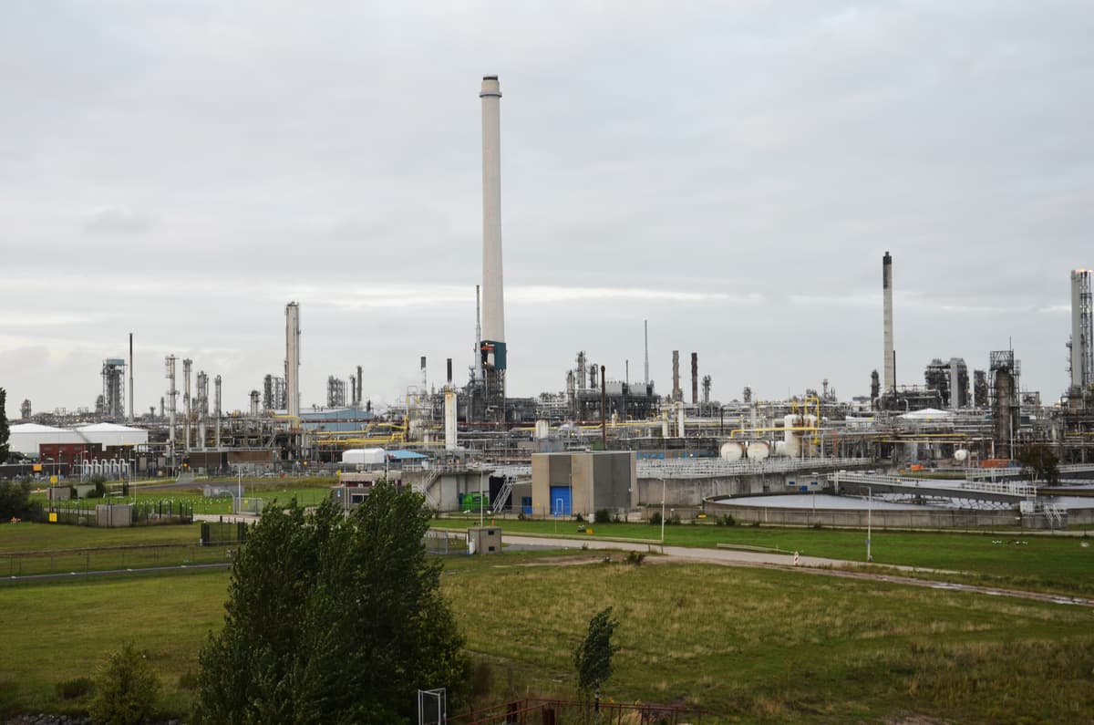 Shell Pernis oil refinery in Rotterdam Netherlands with large storage tanks and processing units