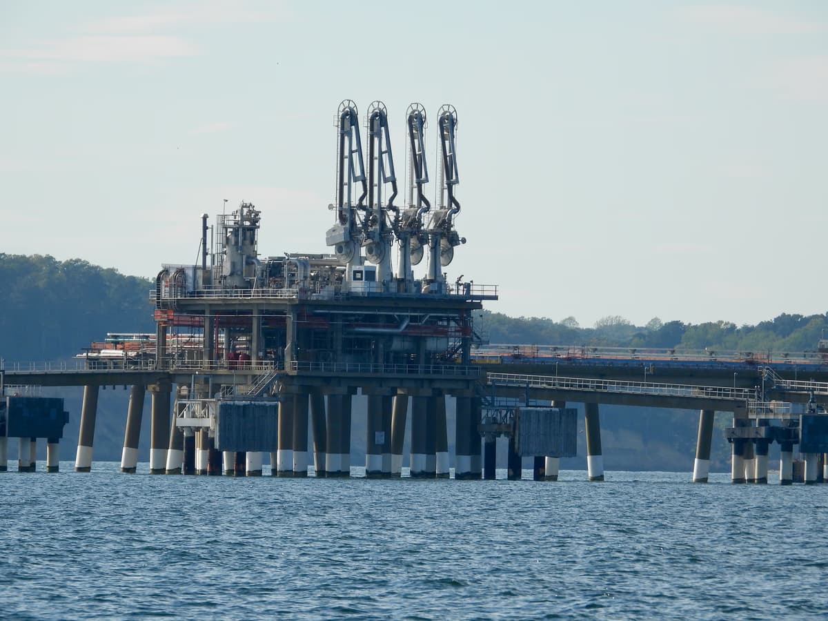 Cove Point LNG terminal facility seen from offshore in Calvert County Maryland with LNG storage tanks and loading pier
