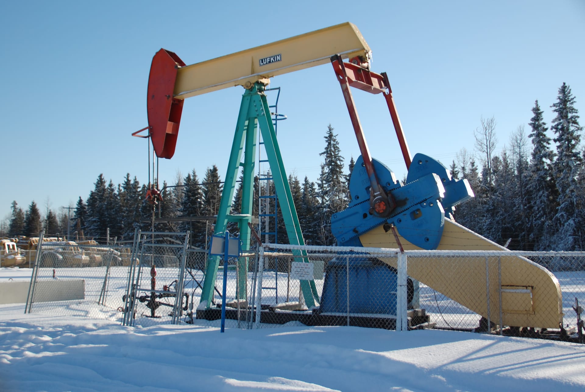 A working pump jack on an oilfield wellsite near Drayton Valley in central Alberta, Canada.