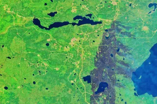 NASA Landsat satellite image of active wildfires burning near Alberta oil sands region