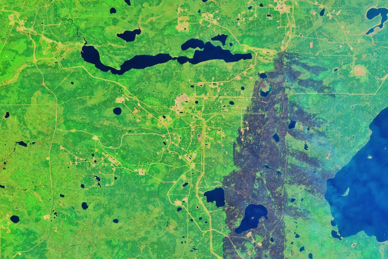 NASA Landsat satellite image of active wildfires burning near Alberta oil sands region