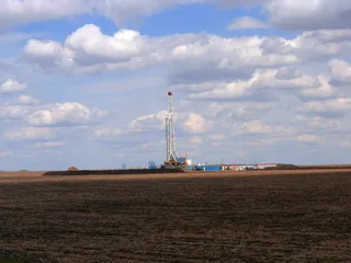 Onshore oil and gas drilling rig in operation at an Alberta well site in western Canada