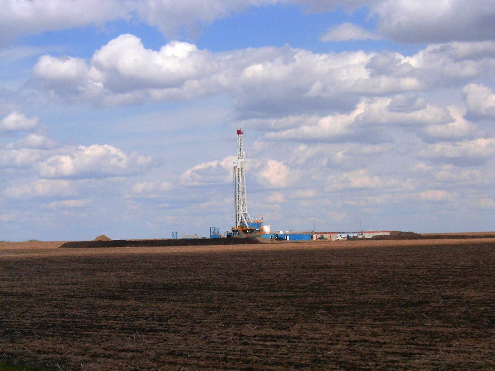 Onshore oil and gas drilling rig in operation at an Alberta well site in western Canada