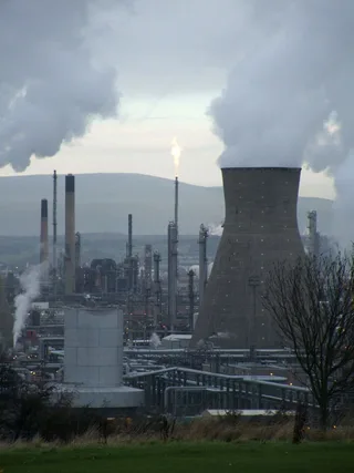 Towers and processing units at a European petrochemical refinery facility with industrial infrastructure