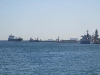BP oil refinery jetty at Kwinana Western Australia with tanker vessels moored at industrial berth