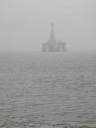 Semi-submersible oil drilling rig in mist on Cromarty Firth near Rosskeen Scotland