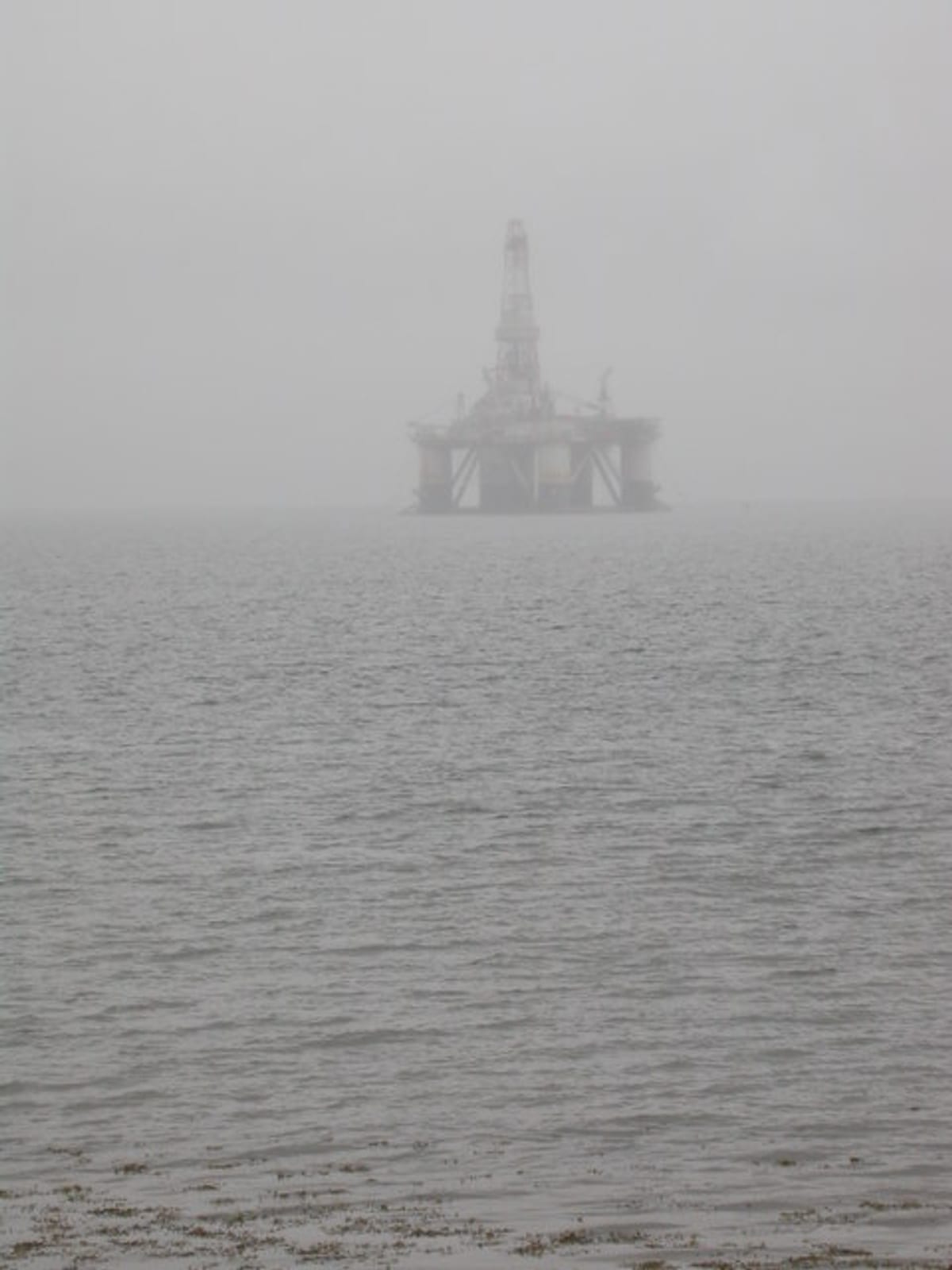 Semi-submersible oil drilling rig in mist on Cromarty Firth near Rosskeen Scotland
