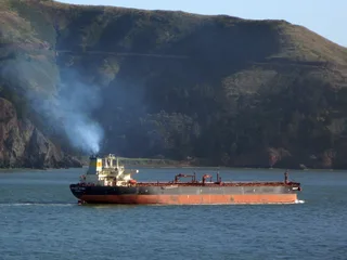 Sonangol-branded Kizomba oil tanker vessel anchored offshore representing Angola's national oil company that supplies feedstock to the Cabinda refinery