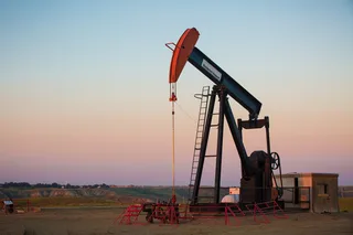 Pump jack and heavy oil production equipment at a Clearwater formation site in Alberta Canada