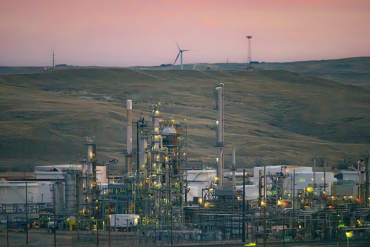Sinclair refinery in Casper Wyoming at sunrise with distillation towers and processing units visible