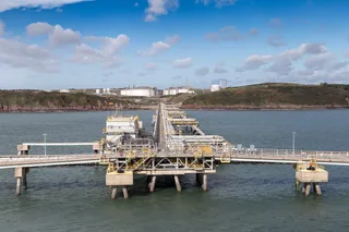 South Hook LNG terminal jetty and pipeline infrastructure on the Welsh coast viewed from sea