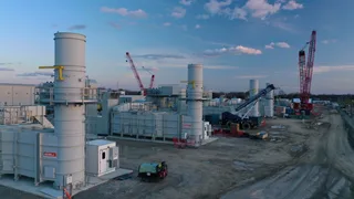 Aerial drone view of a Williams Transco natural gas pipeline construction right-of-way and compressor station expansion in the US Southeast