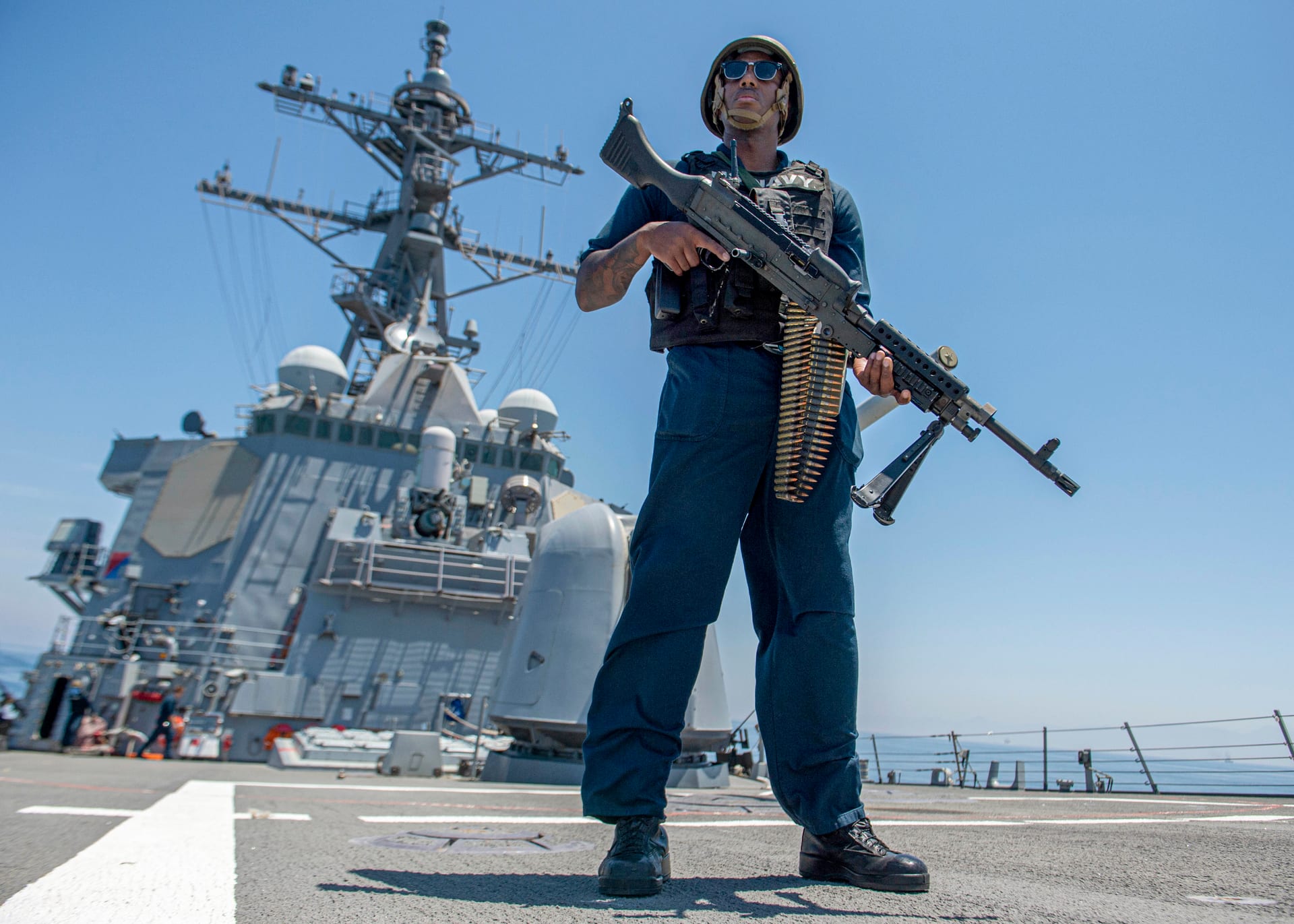 US Navy vessel transiting the Strait of Hormuz, gateway for Iranian crude exports