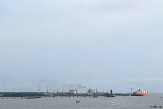 LNG terminal industrial facility on the Bonny River in Rivers State Nigeria with offshore vessels