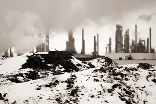 Alberta oil refinery processing towers and storage tanks in evening light, April 2011