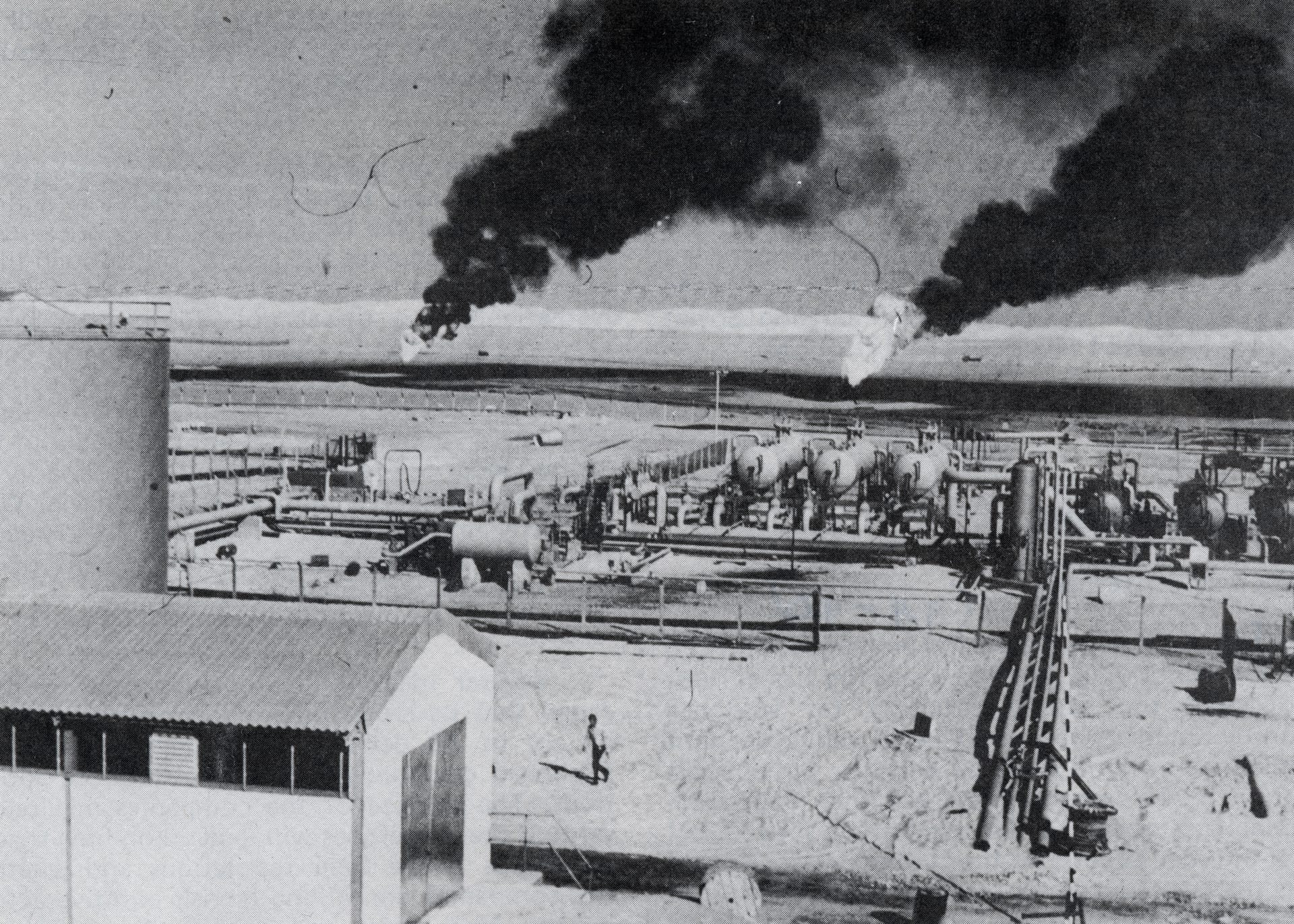 Aerial view of a Libyan crude oil production facility showing storage tanks and oilfield infrastructure, photographed in 1973
