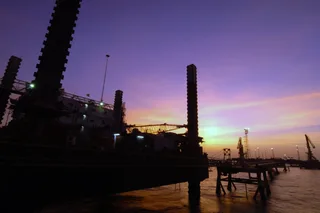 Khawr Al Amaya Oil Terminal in Iraq at sunset, a floating oil export platform in the Persian Gulf