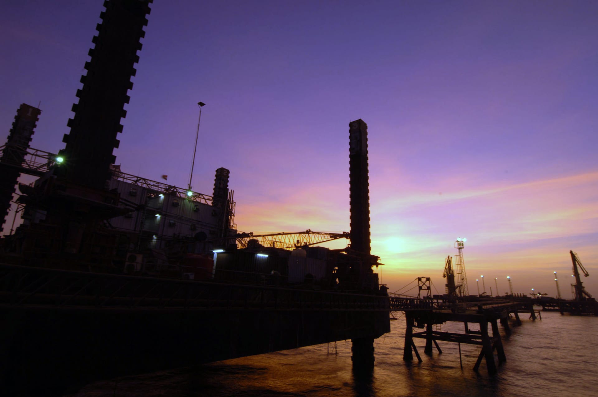 Khawr Al Amaya Oil Terminal in Iraq at sunset, a floating oil export platform in the Persian Gulf