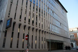 OPEC headquarters building in Vienna Austria with stone facade and corporate signage on entrance