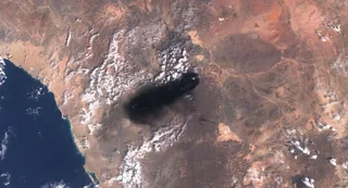 Satellite view of smoke rising from Saudi Arabia's East-West crude oil pipeline