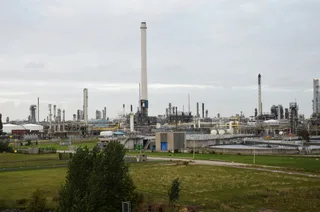 Shell Pernis oil refinery in Rotterdam Netherlands with large storage tanks and processing units