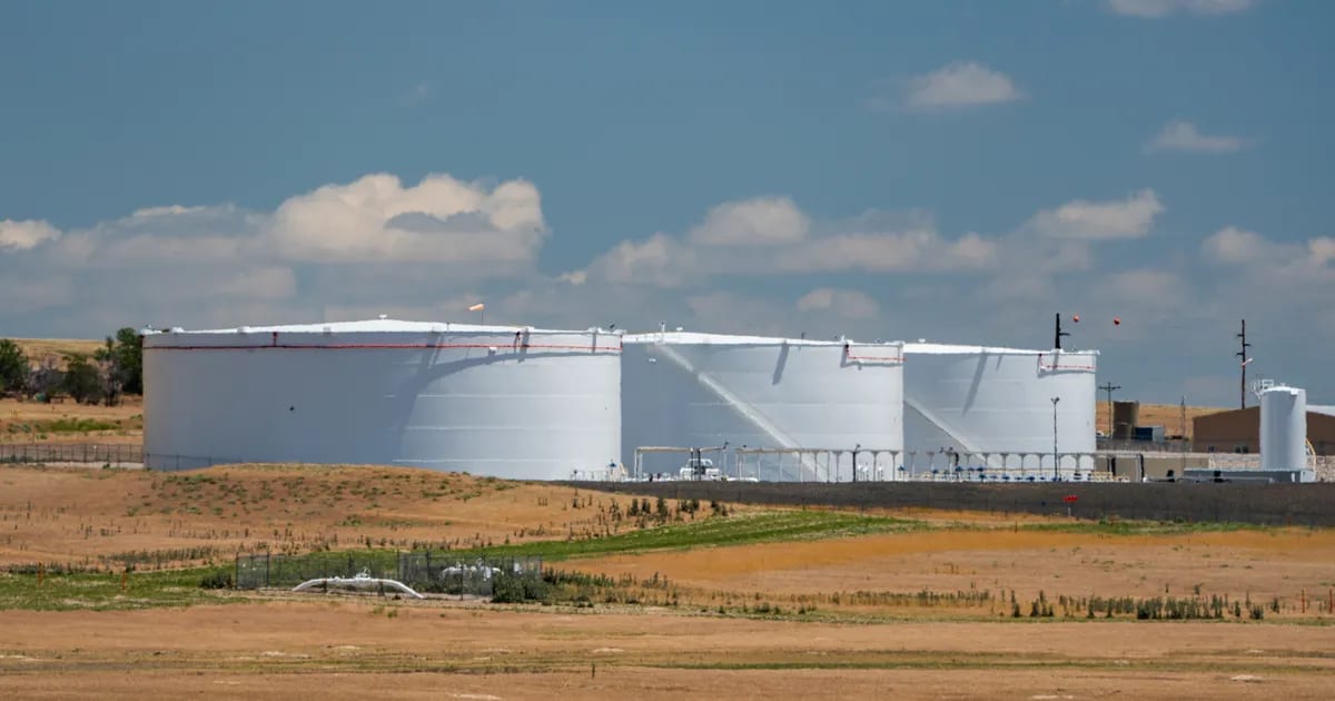Suncor Energy crude oil storage tank farm in Wyoming with rows of large white storage tanks