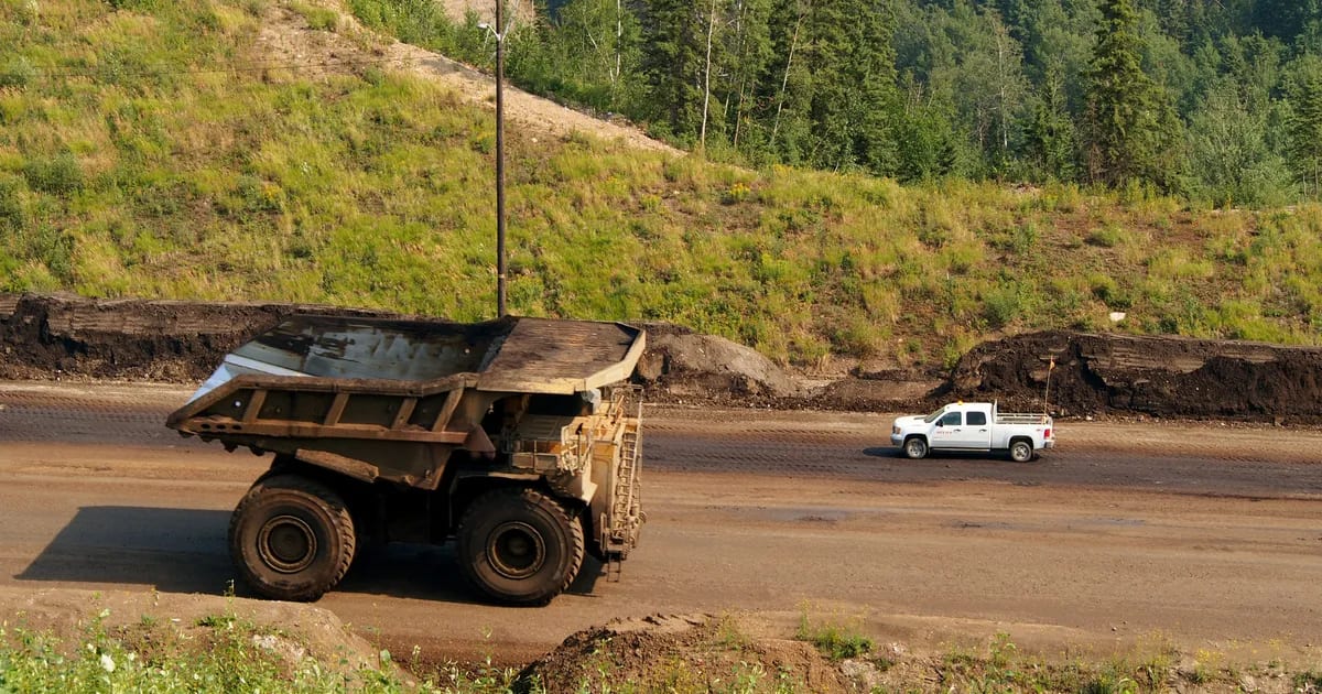 Caterpillar 797 mining haul truck on a haul road in the Athabasca oil sands near Fort McMurray, Alberta