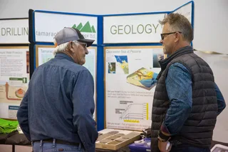 Residents discuss Clearwater geology display at a Tamarack Valley Energy community open house in Alberta
