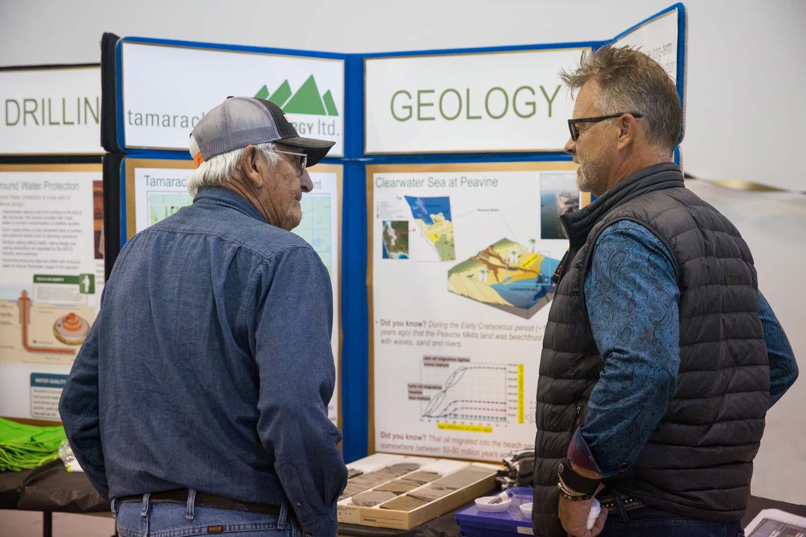 Residents discuss Clearwater geology display at a Tamarack Valley Energy community open house in Alberta