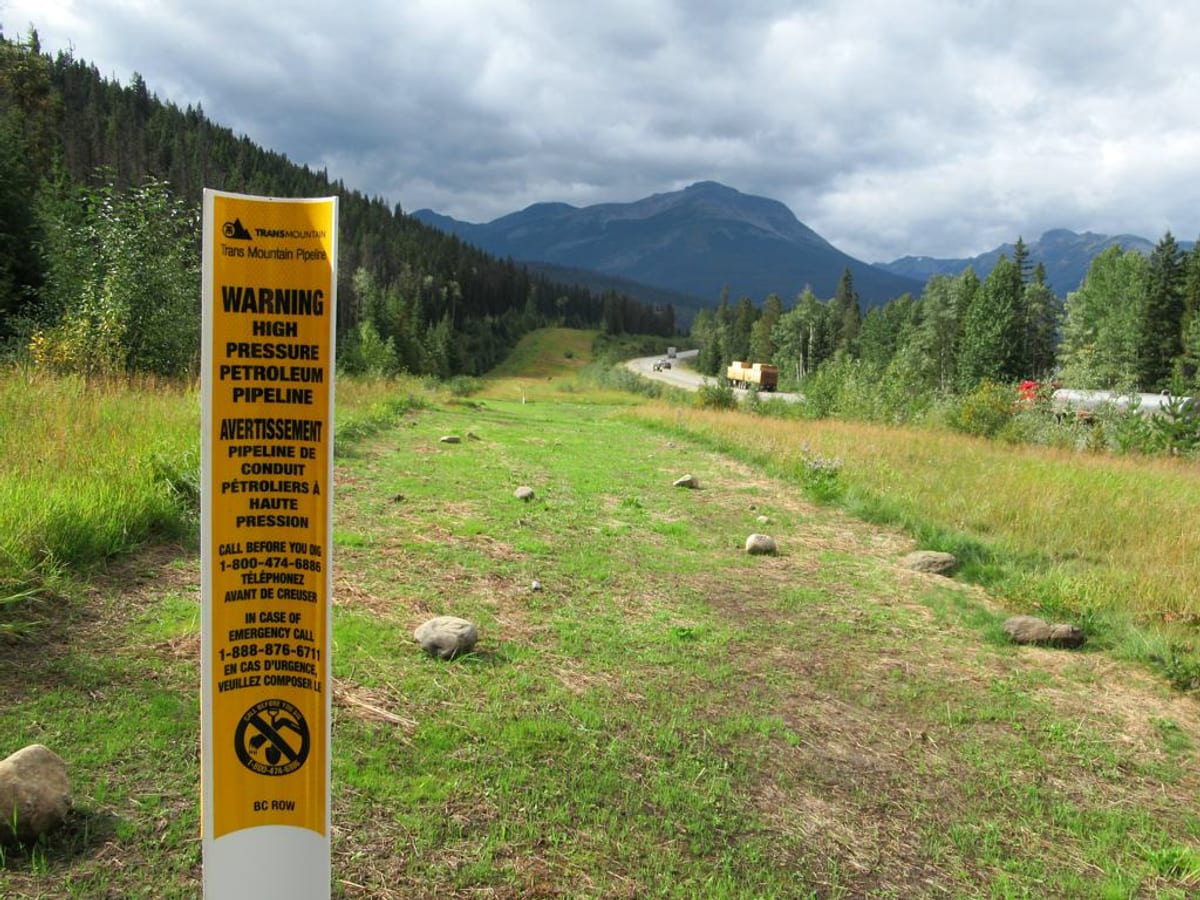 Trans Mountain Pipeline running alongside Yellowhead Highway in British Columbia Canada carrying oil from Edmonton to Burnaby