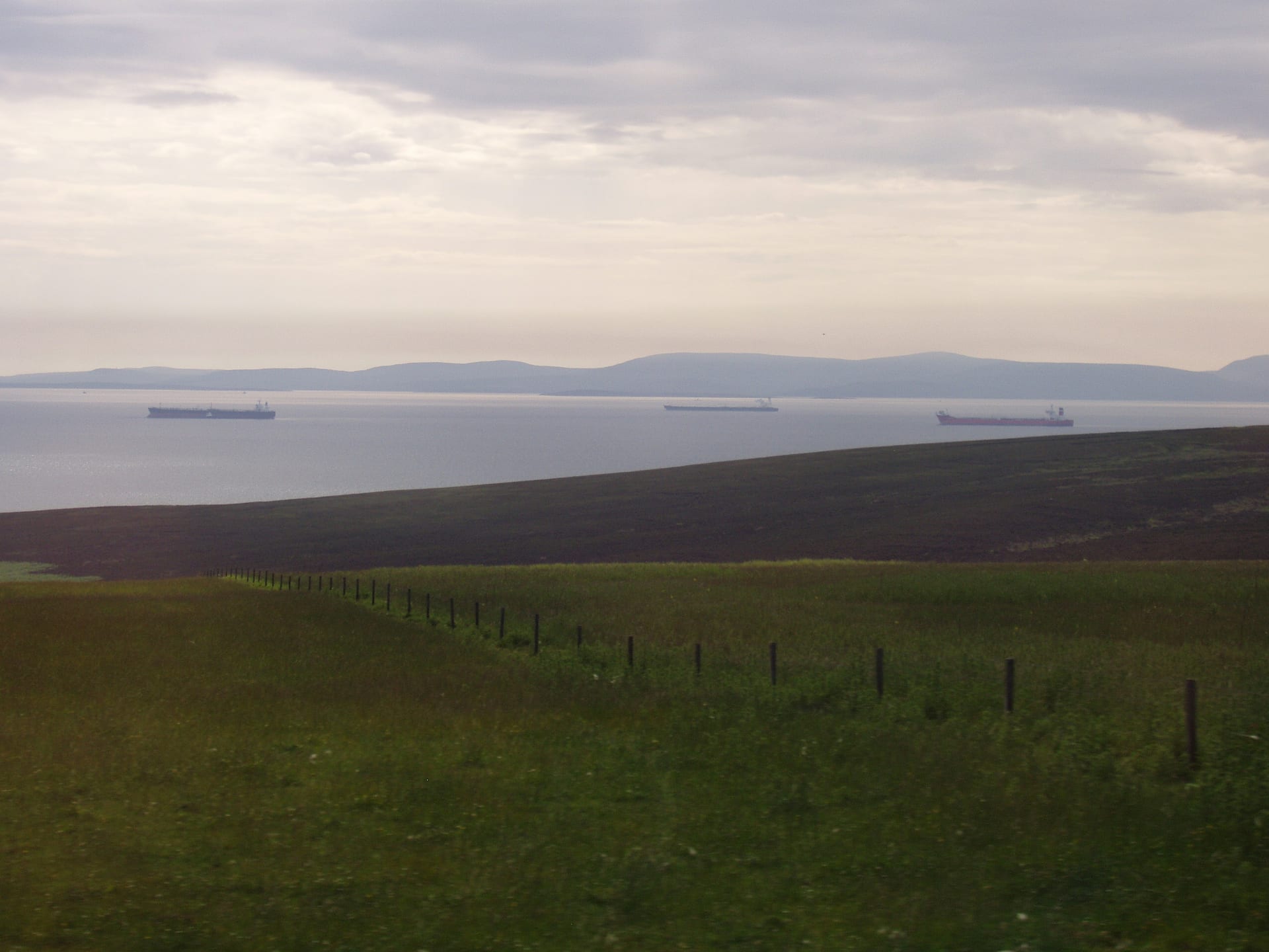 Multiple petroleum tankers waiting at anchor in calm waters, Scapa Flow Orkney Islands