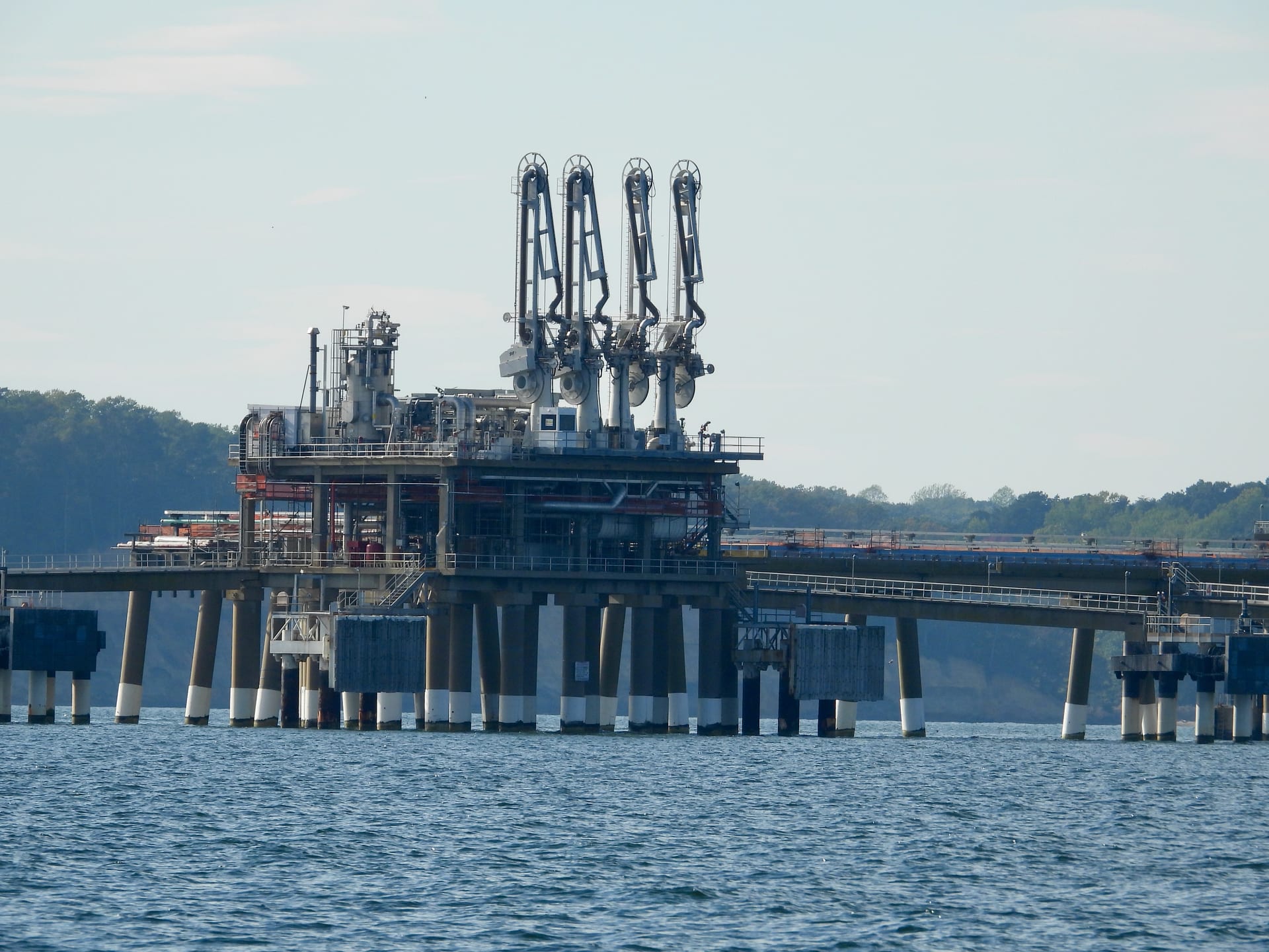 Cove Point LNG terminal facility seen from offshore in Calvert County Maryland with LNG storage tanks and loading pier