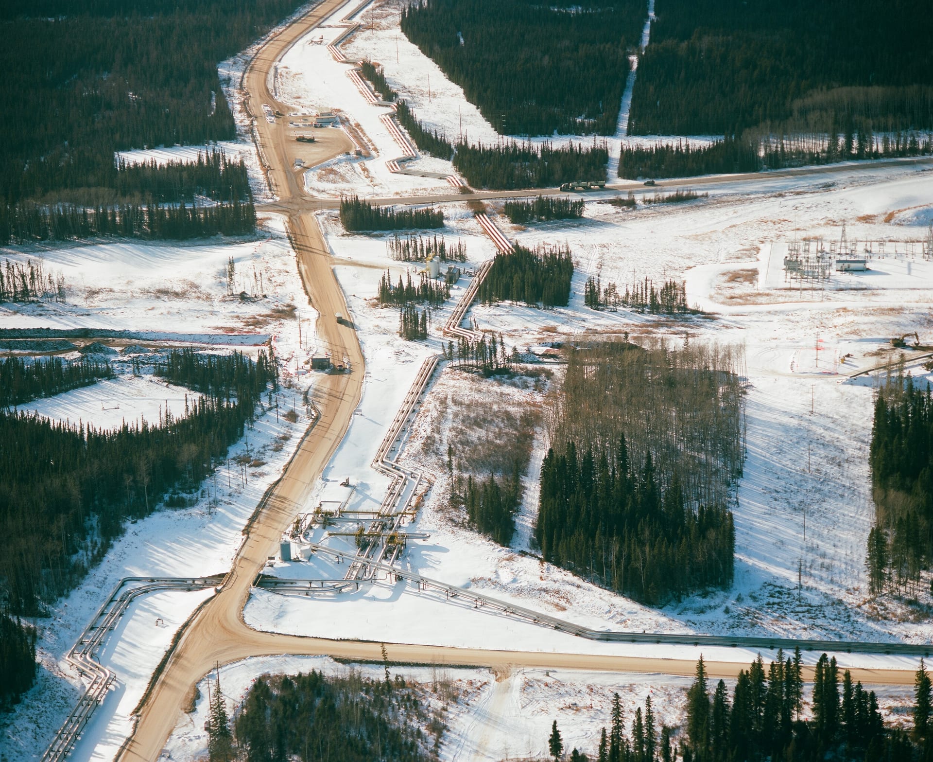 Aerial view of SAGD oil sands pipeline crossing Highway 881 in northern Alberta operated by ConocoPhillips Canada