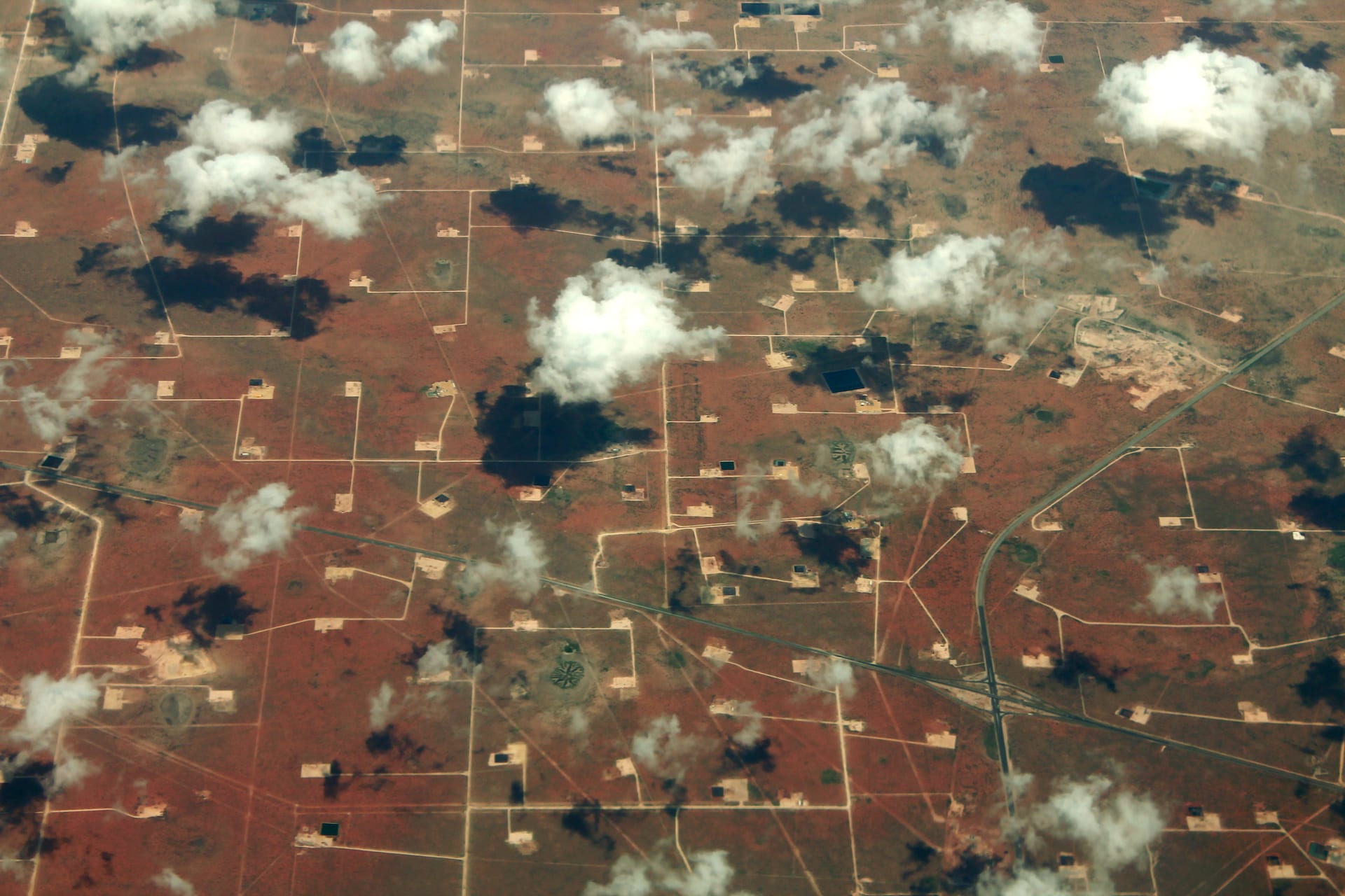 Aerial view of Permian Basin oil fields near Midland Texas showing production infrastructure